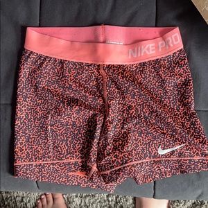 Nike Pros Orange and Black Pattern